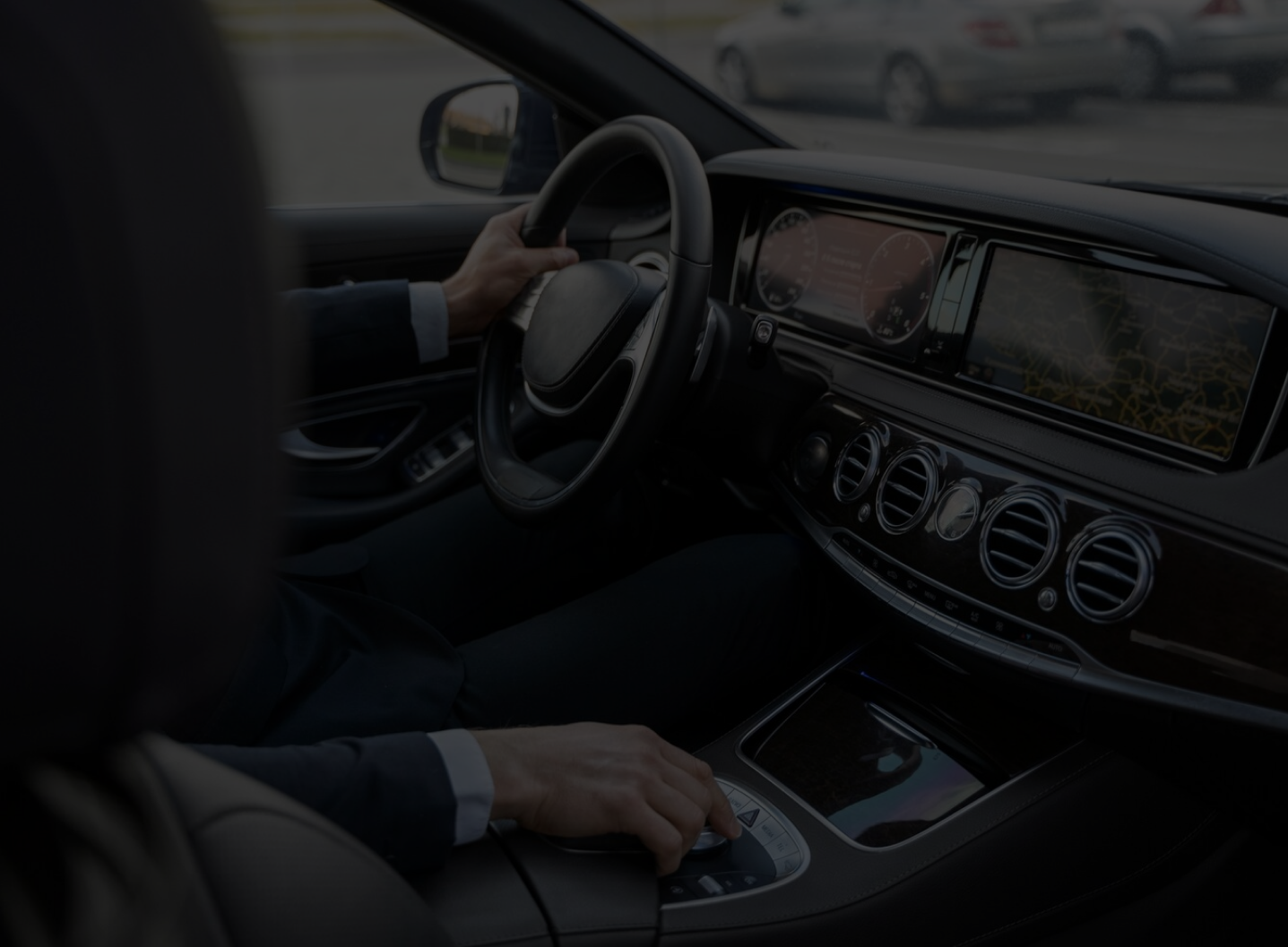 Chauffeur driving a luxury sedan